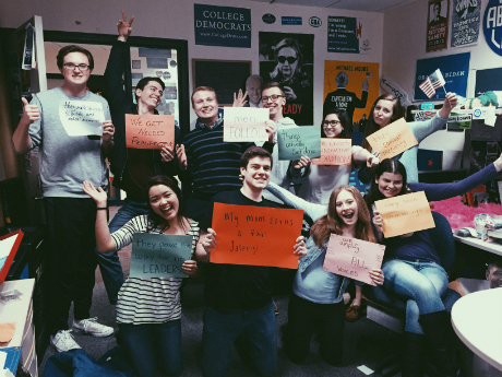 group of people holding up signs