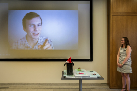 kelsey standing in front of presentation screen