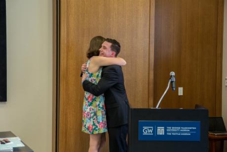 kelly in an embrace after winning a reward