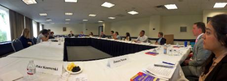 large table of meeting participants