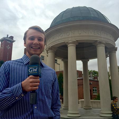 man holding GW microphone in front of  GW tempetto 