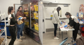 Nina, Jack and Markella volunteering at the GW Store